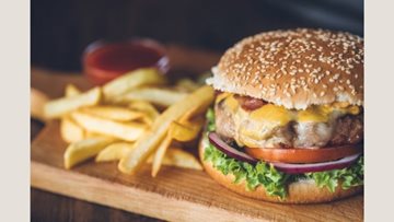 Roxburgh House care home Resident enjoys beloved burger treat