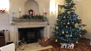 Residents rock around the Christmas tree at Tetbury care home