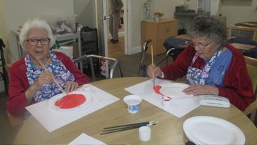 Residents create poppy display for Remembrance Day at Swansea care home